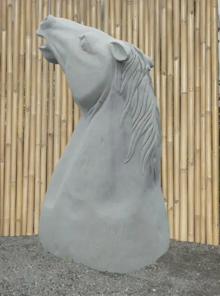 Product image of the product “Head of a Horse made from Riverstone, looking up. 190cm Height. ”